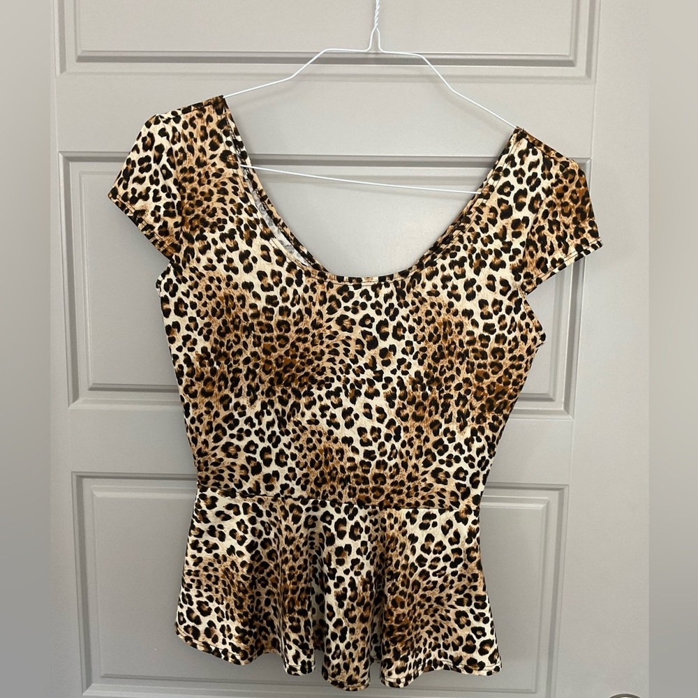 Leopard Print Peplum Top. Short Sleeve. Peek A Boo Back